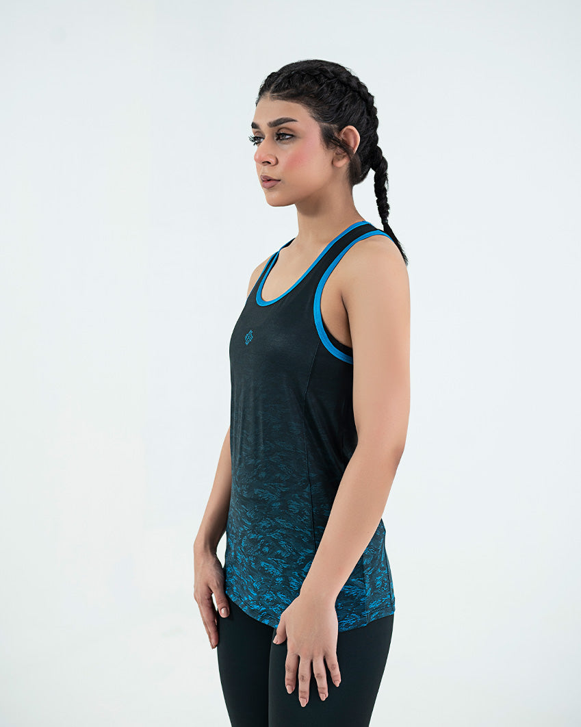 A woman wearing a black and blue tank top on a white background, perfect for those who want to Buy Womens Gym Wear Tank Top Online In Pakistan.
