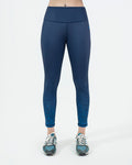 women Navy blue leggings for gym and activewear worn by a person on a white background