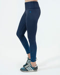 women Navy blue leggings for gym and activewear worn by a person on a white background