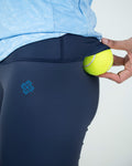 women Navy blue leggings for gym and activewear worn by a person on a white background